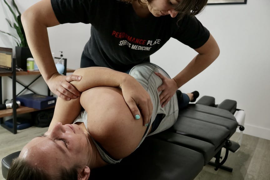 sports chiropractor adjusting women athlete orange county